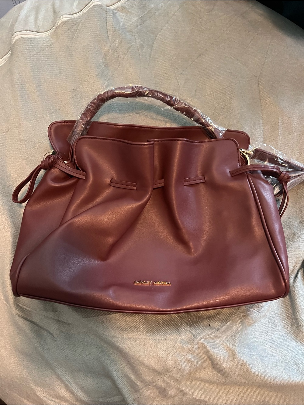 Badgley Mischka burgundy vegan leather drawstring satchel/shoulders bag